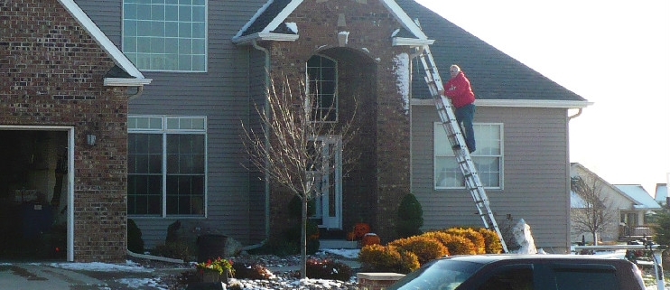 Sun Prairie, WI home with new roof replacement asphalt shingle roof by Paramount Roofing and Siding LLC