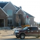 Sun Prairie, WI home with new roof replacement asphalt shingle roof by Paramount Roofing and Siding LLC